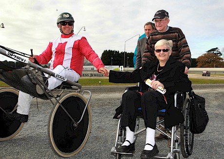 Trainer Colin Butler and his ill wife Raelyne celebrate with driver Phil Butcher after Charlemagne’s $90 upset in 2012. Butcher started from the inside of the second row but was able to weave into the one-one at the bell.