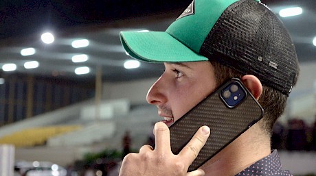 Stable foreman Andrew Drake takes a call from a wellwisher immediately after the race.