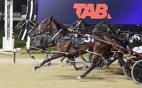 My Copy finishes powerfully from the trail to beat Twista and Hugotastic on mile night. PHOTO: Megan Liefting/Race Images.