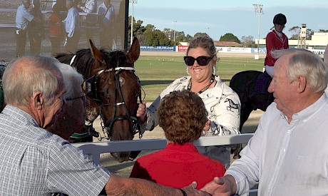 FAMILY AFFAIR: John Street, right, and his brother Kevin shake hands as sister Bev, centre, greets Colonel Lincoln after the race.