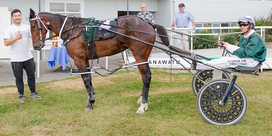 Co-trainer Nathan Delany gives the thumbs up to Spiritual Bliss and driver Harrison Orange. PHOTO: Jack McKenzie/Race Images.