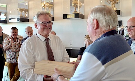 John Street presents David Turner with the trophy won by Lincoln Wave.