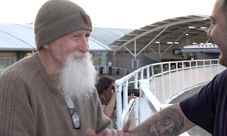 Co-trainer Nathan Delany congratulates Dave Phillips after Spiritual Bliss’ win.